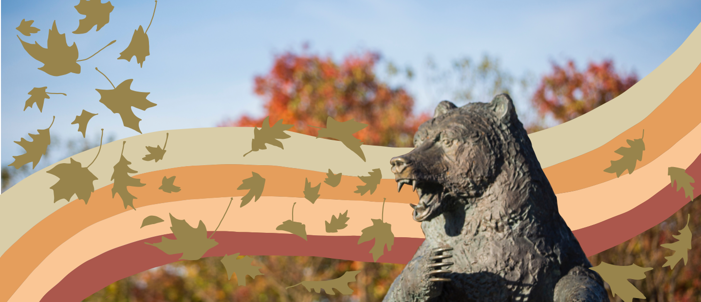 奥克兰大学校园里的灰熊雕像，上面绘有彩虹和金色树叶万博ManBetX登录